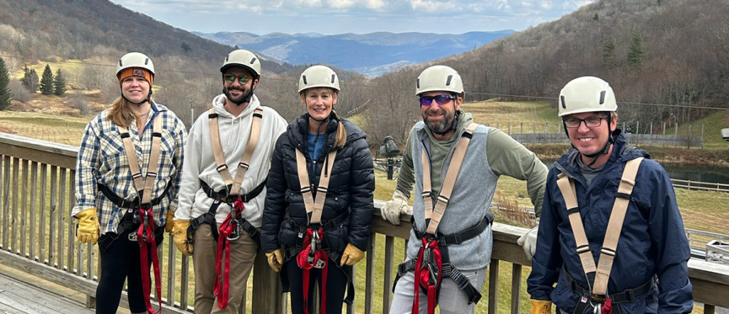 peaktwo team zip lining at hawks nest